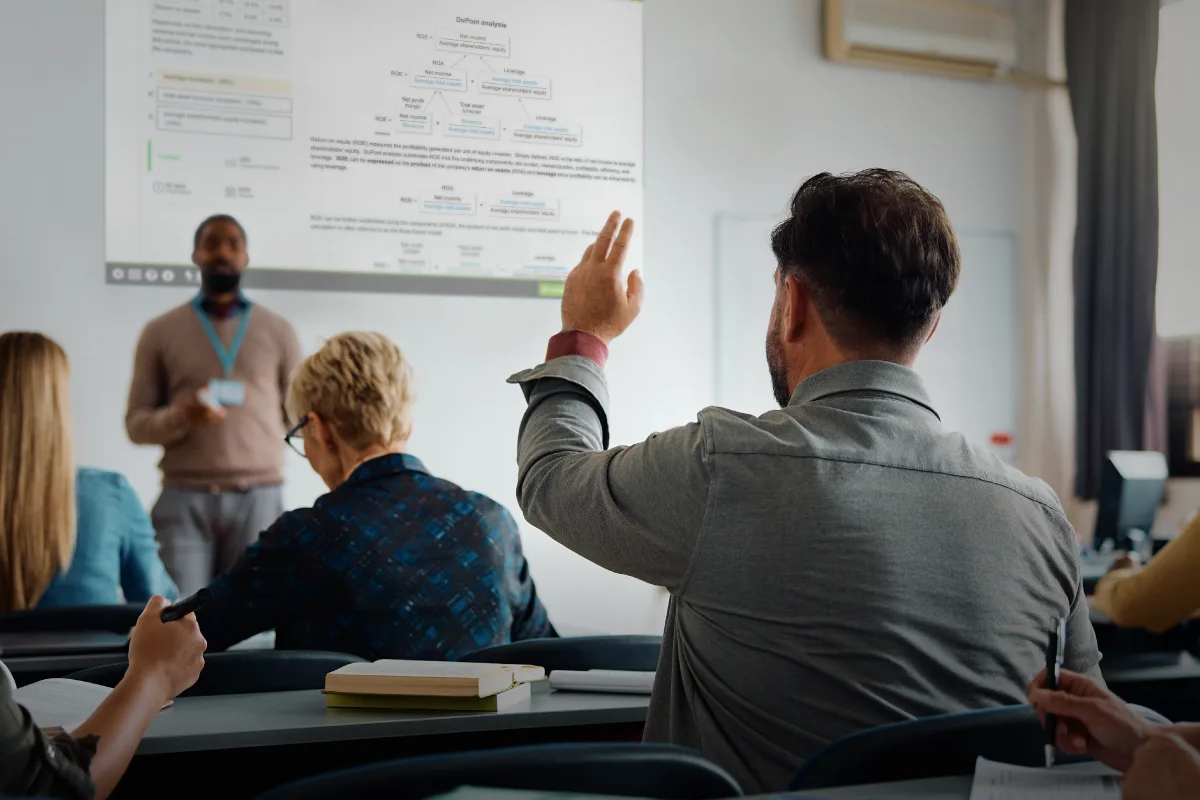 An instructor at the front of the room teaching CFA Level 1